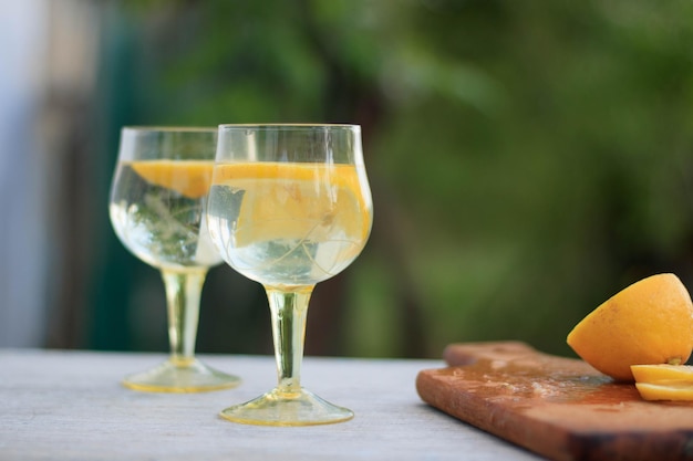 Fresh summer drink Cold lemonade with mint on a concrete background