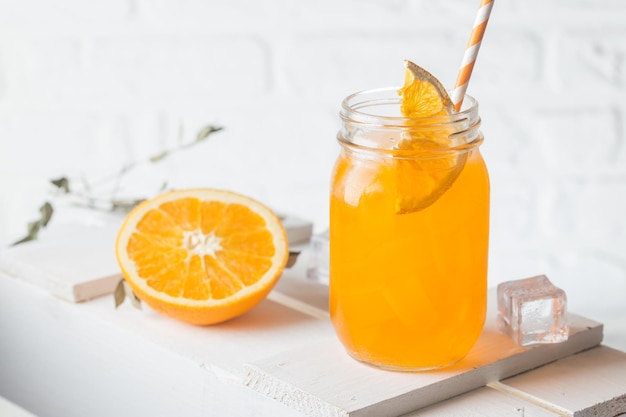 Fresh summer orenge cocktail in glasses on white background