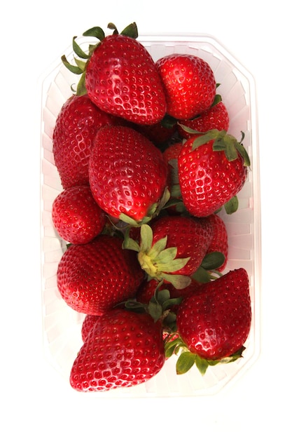 Fresh sweet strawberries in plastic container