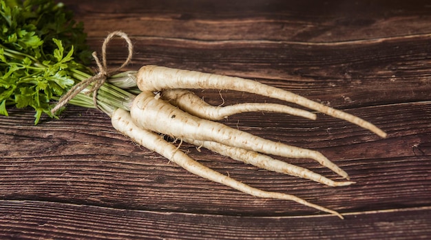 fresh and sweet white parsley on a wooden table from small village garden