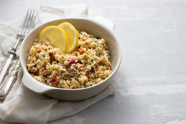 Fresh tabbouleh on small plate on ceramic