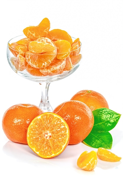 Fresh tangerines and glass of juice isolated on white background