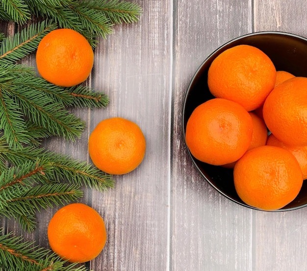 Fresh tangerines on wooden table, closeup. banner for Christmas and New Year