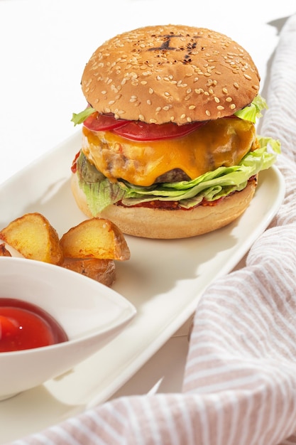 Fresh tasty Burger with beef on a white plate