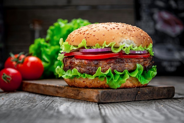 Fresh tasty burger on wood table