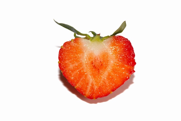 Fresh tasty half cut Strawberry isolated on white background