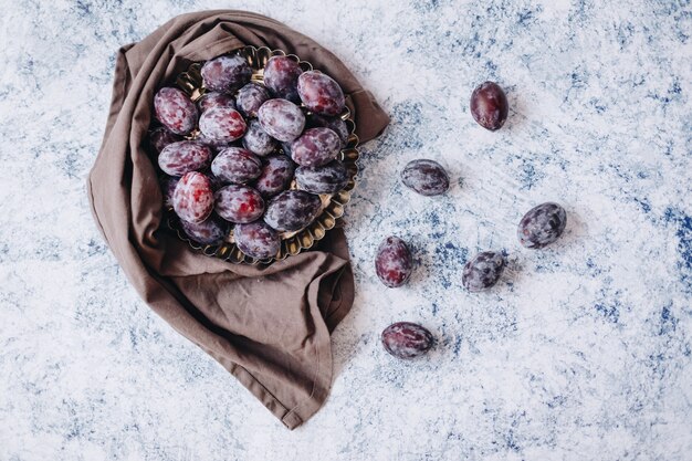 Fresh and tasty plums on the table