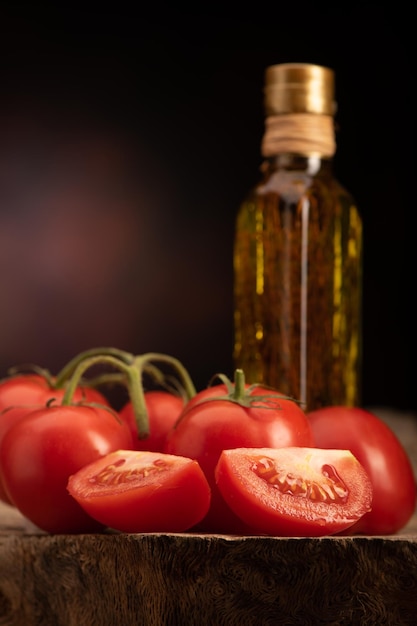 Fresh Tomato and olive oil on the wooden table