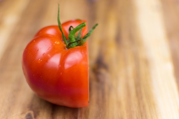 Fresh tomato on a wooden background