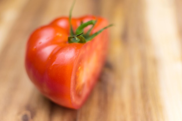 Fresh tomato on a wooden background