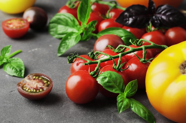 fresh tomatoes of different varieties mini bell peppers spices rammarine thyme basil chilli pepper