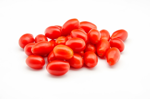 Fresh Tomatoes on white table