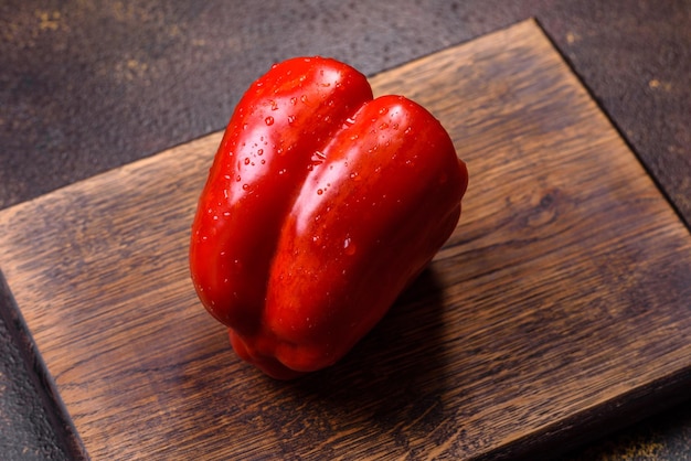 Fresh torn red sweet pepper from the autumn harvest