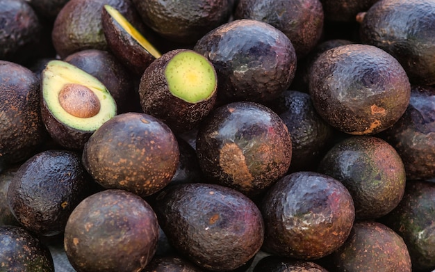 Fresh tropical avocado fruit close up display for sell at the market, good for background