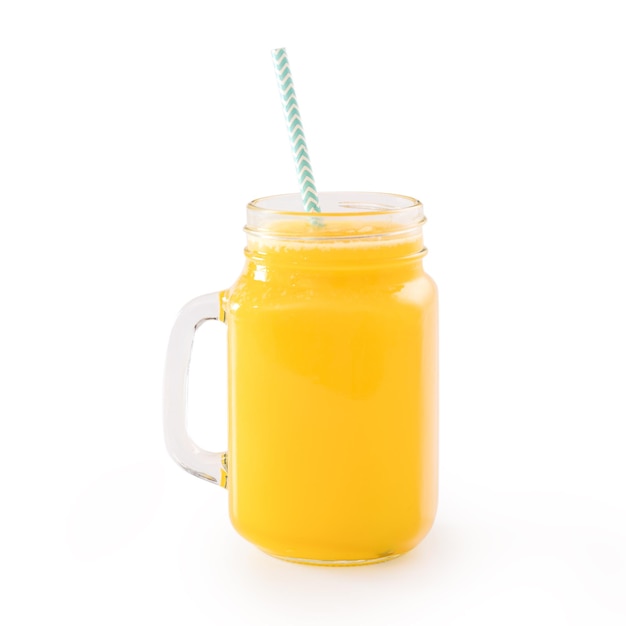 Fresh tropical mango juice with beautiful diced fruit flesh striped paper straw isolated on white background table close up cut out clipping path