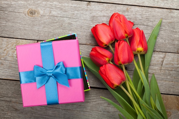 Fresh tulips and gift box