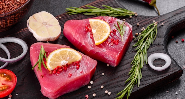 Fresh tuna fillet steaks with spices and herbs