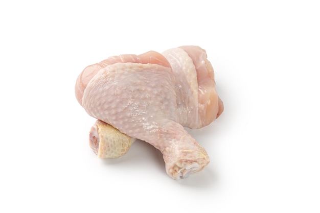 Fresh uncooked raw chicken legs drumsticks isolated on a white background with clipping path cut out