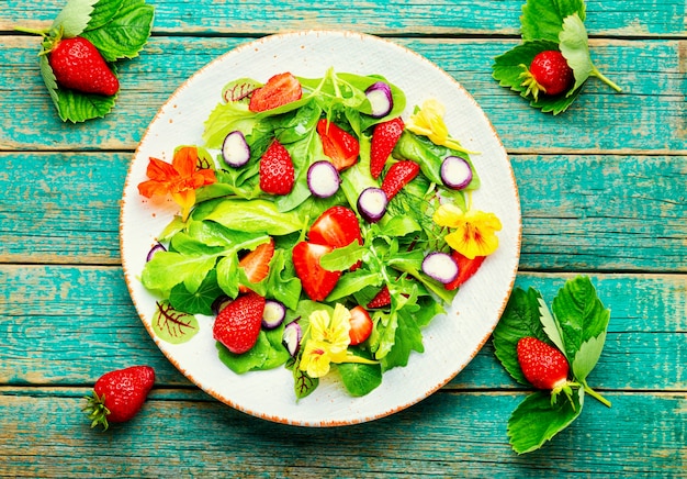 Fresh vegan salad of green ripe strawberries.Summer vitamin salad.