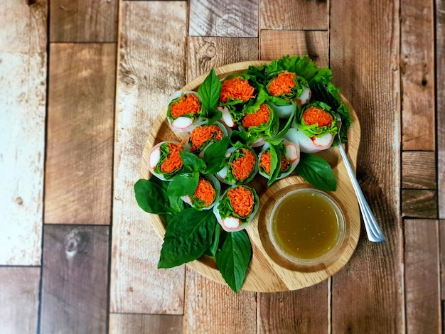 Fresh vegetable rice wraps with seafood sauce.Thai appetizer menu is healthy food.