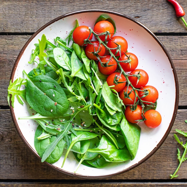 fresh vegetable salad tomato cherry veggie green leaves mix greens spinach arugula lettuce healthy food mealn