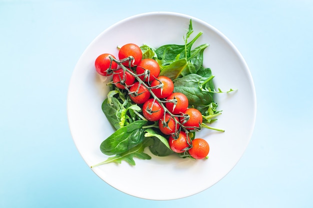 fresh vegetable salad tomato cherry veggie green leaves mix greens spinach arugula lettuce healthy food mealn