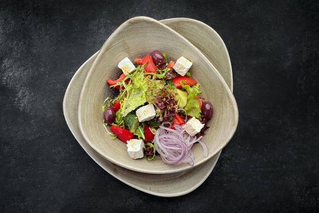 Fresh vegetable salad with cheese on a plate