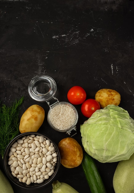 Fresh vegetables on the black background. Healthy food concept