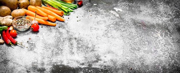 Fresh vegetables. Fresh vegetables with spices and herbs on rustic table.