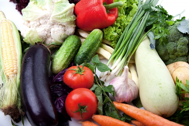 Fresh vegetables fruit on white