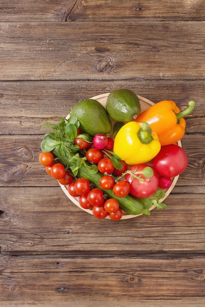 Fresh vegetables on old wooden table