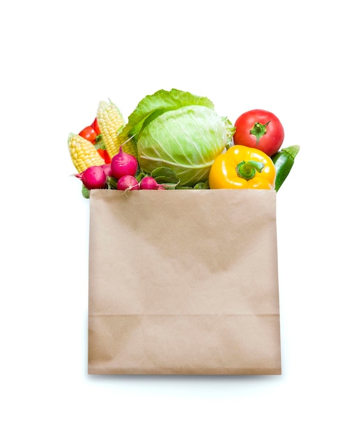 Fresh vegetables in paper bag isolated on white