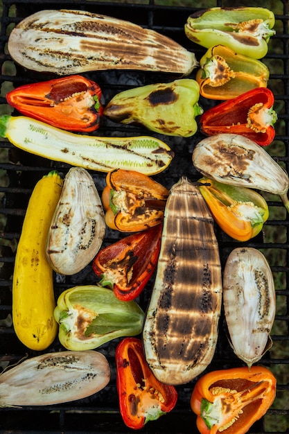 Fresh vegetables prepared on the grill outside.