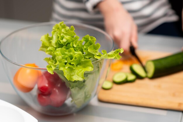 Fresh vegetables in a transparent plate on the table Healthy eating