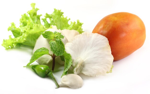 Fresh vegetables over white