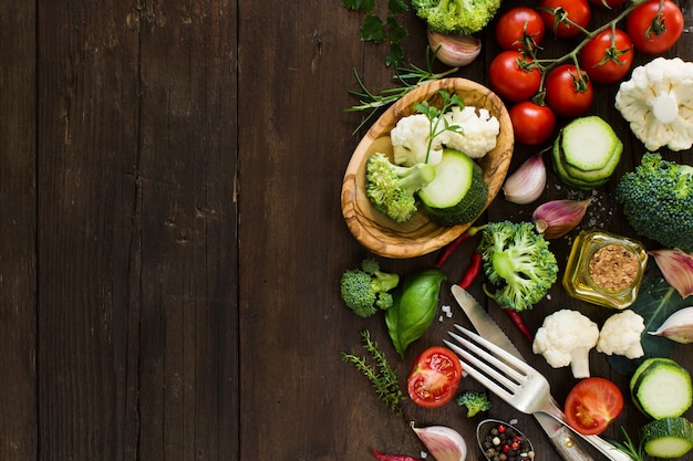 Fresh vegetables on a wooden table top view