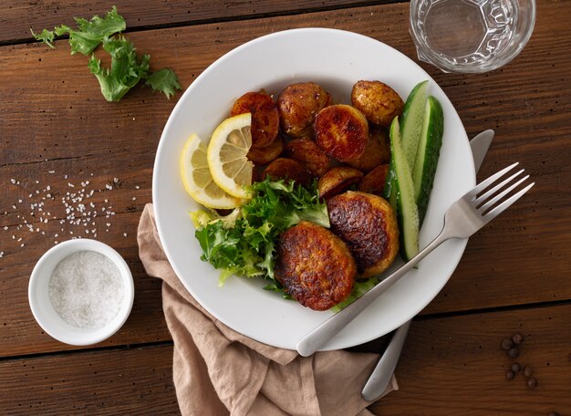 Fresh vegetarian cutlets with new potatoes and salad