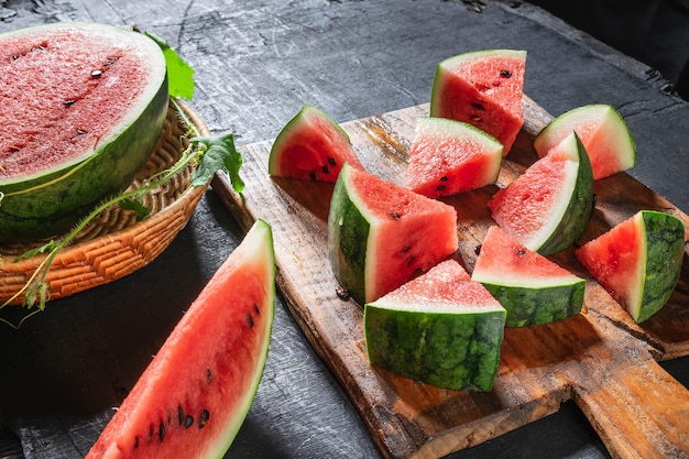 Fresh water melon slices on a wooden cutting board