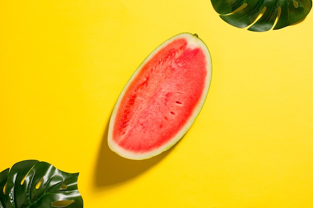 The fresh watermelon on yellow studio background