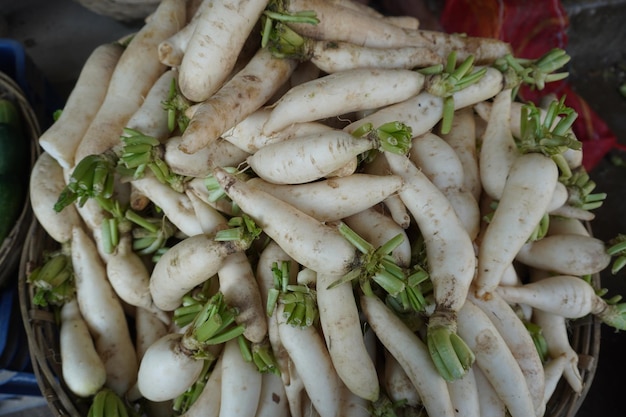 Fresh white radish on a basket