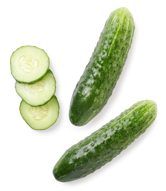 Fresh whole cucumber and slices closeup on a white background isolated Top view