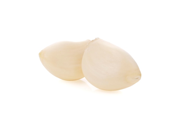 Fresh whole peeled garlic gloves isolated on white background