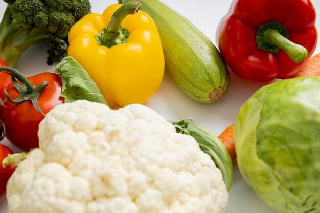 Fresh whole vegetables on a white table Cooking diet