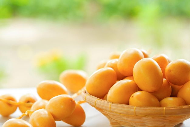 Fresh yellow dates in a basket on the table