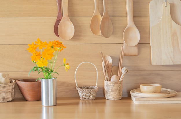 Fresh yellow flowers in the vase and kitchen