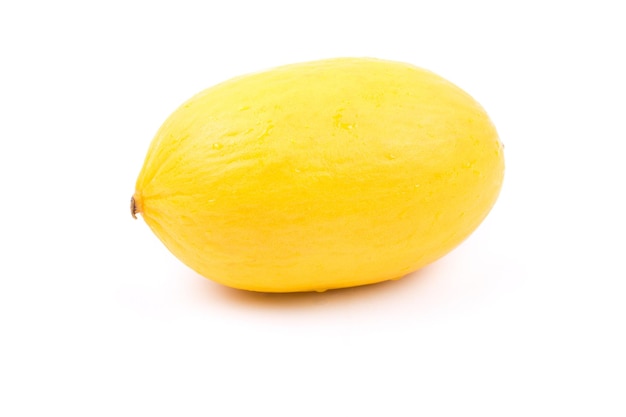 Photo fresh yellow melon with half on a white background