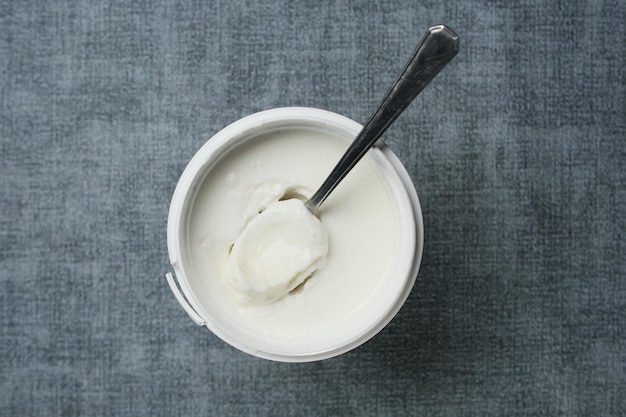 Fresh yogurt in a bowl on table