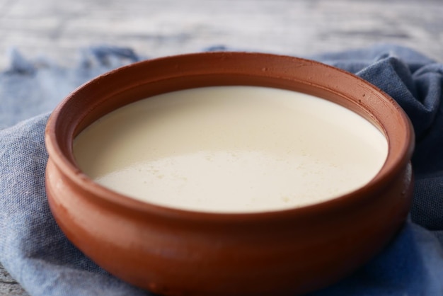 Fresh yogurt in a bowl on table