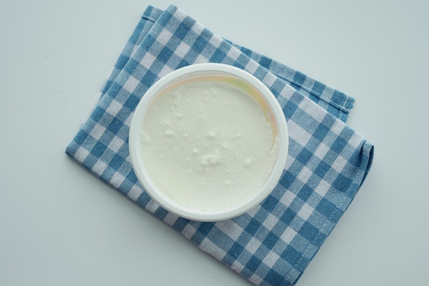 Fresh yogurt in a bowl on table