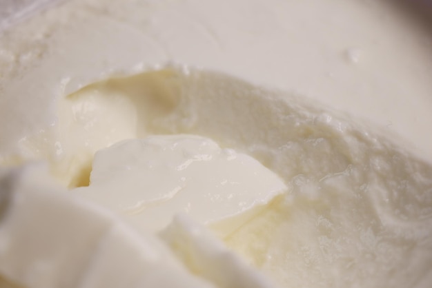 Fresh yogurt in a bowl on table